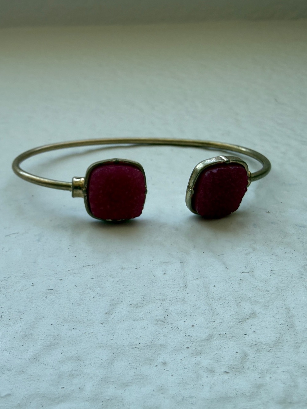 Vintage gold-tone cuff bracelet with magenta accents
